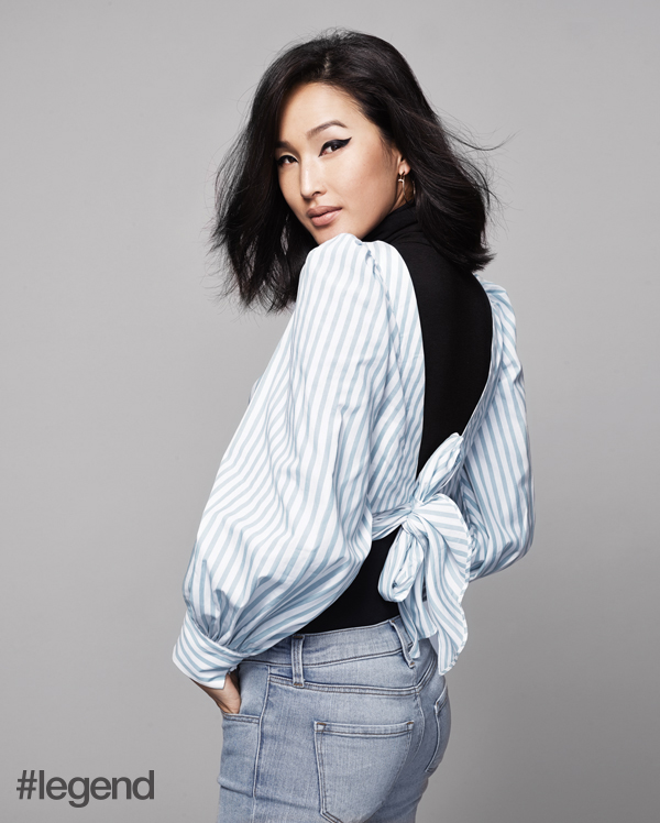 Top by Johanna Ortiz at NET-A-PORTER, bodysuit by Wolford at NET-A-PORTER, jeans by J Brand at NET-A-PORTER, handbag by Roger Vivier,  and jewellery by Cartier